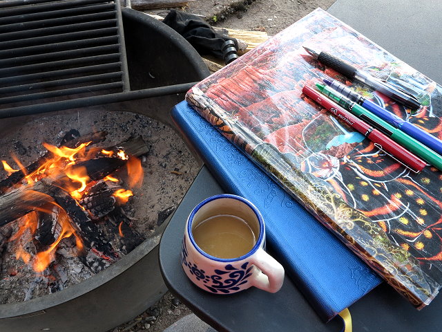 Campfire, coffee, and journal